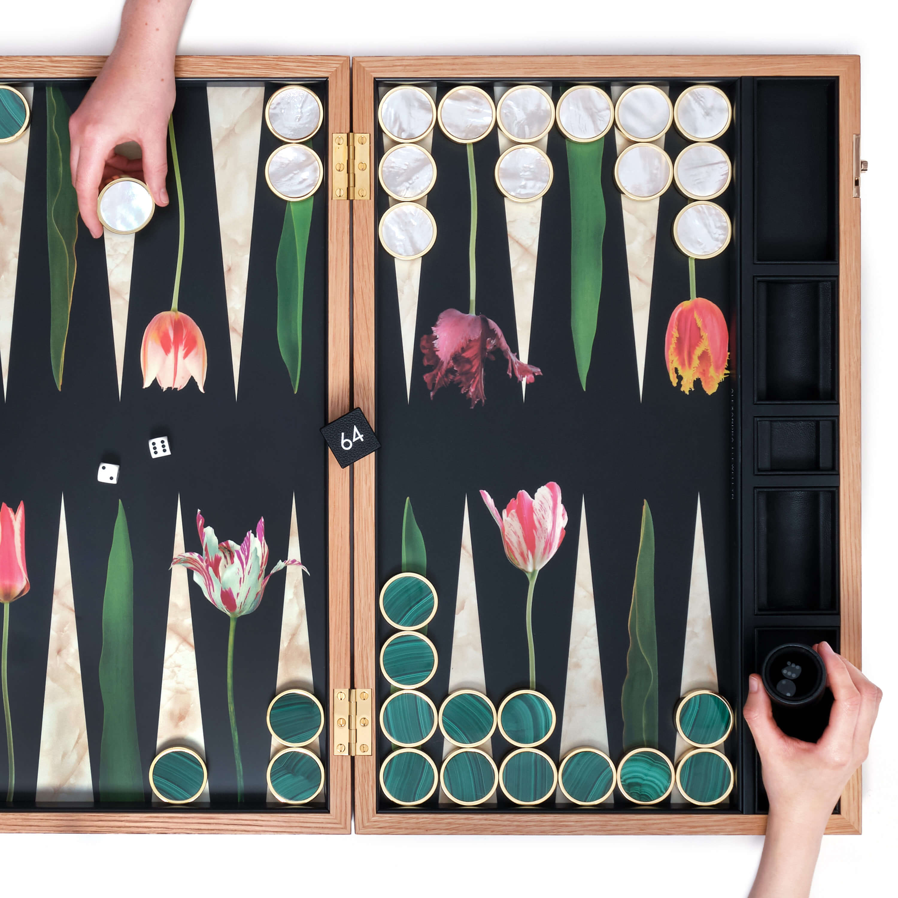 Malachite and white Mother of Pearl stone playing pieces on a Tulip design board