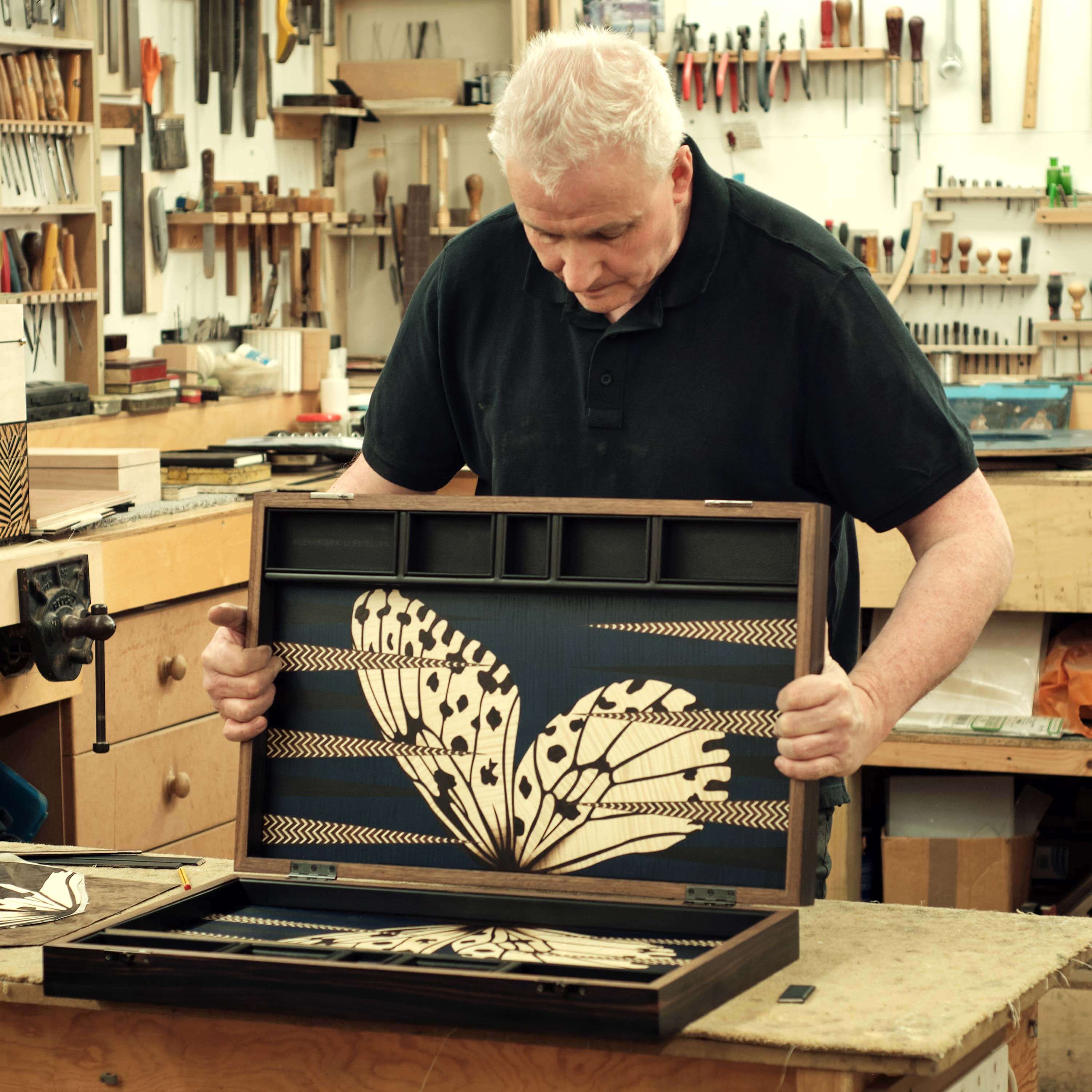 A master joiner crafting a backgammon set